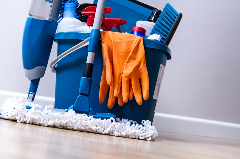 A bucket full of cleaning supplies.